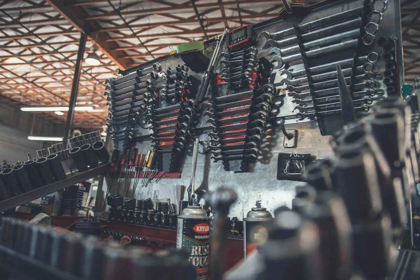 Organised wrench and socket wall inside the QuickFix car repair workshop in Dubai